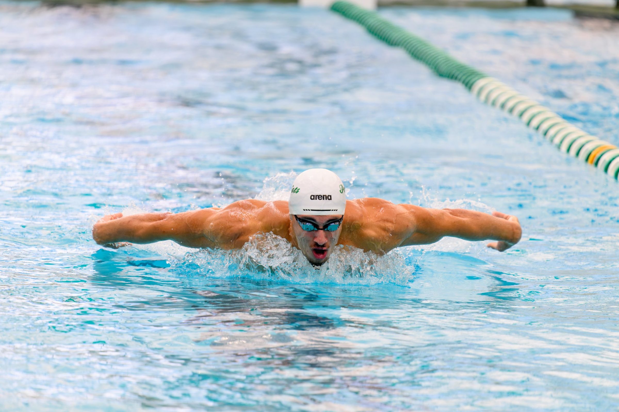 Aoun Al-Hiari swimming butterfly in competition